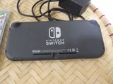 a nintendo switch lite sitting on top of a table