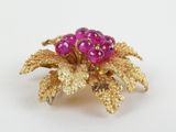 gold plated brooch with pink stones and gold leaves