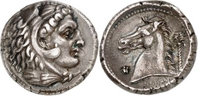 a silver coin with an image of a horse on it