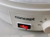 a close up of a white crock pot on a counter