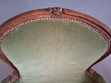 an image of a chair with a green upholstered seat