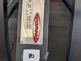 a close up of a parking meter with a sticker on it