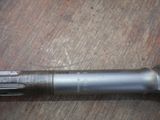 a pen that is laying on a wooden table
