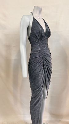 the mannequin is wearing a gray dress with a large ruched skirt