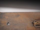 a rusted metal object with a hole in the middle of it