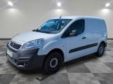 a white van parked in a room with a checkered floor