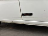 a white car with a sticker on the side of it