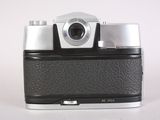 a black and white photo of a camera on a white surface
