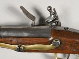 a close up of a gun that is on a table