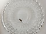 a glass plate that has a small piece of gold in it