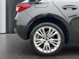 a close up view of a car ' s wheels and rims