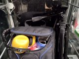 a bag of items in the back of a bus