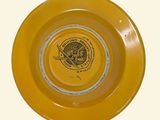 a yellow plate with a picture of a train on it