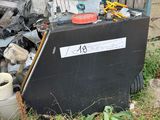 a pile of trash outside of a building with a sign on it