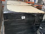 a large stack of boxes in a warehouse with a price tag on it