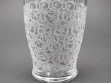 a close up of a glass vase with a plaque on it