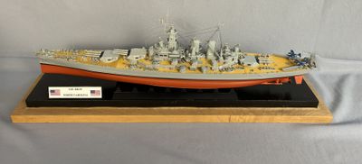 a model of a battleship on display on a table