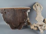 pair of antique wooden sconces with carved details on the sides