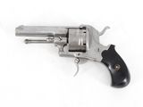 a close up of a revolver on a white surface with a white background