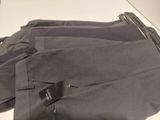 a pair of pants sitting on a table with a price tag