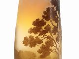 a vase that has a picture of a tree on it
