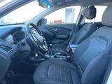 the interior of a car with black leather seats and a steering wheel