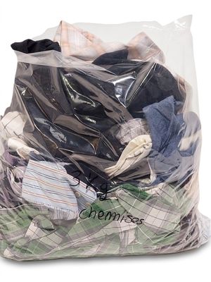 a bag full of clothes that is sitting on a table