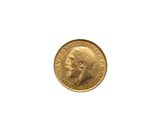 a close up of a gold coin with a man ' s face on it