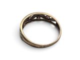 a close up of a ring on a white surface with a white background