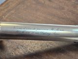 a metal pipe with writing on it sitting on a table
