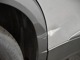 a close up of a car ' s tire with a sticker on it