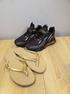 two pairs of black and gold flip flop flop flop flop flop flop flop flop flop flop flop flop flop flop