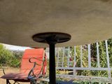 an image of a patio with a table and chairs