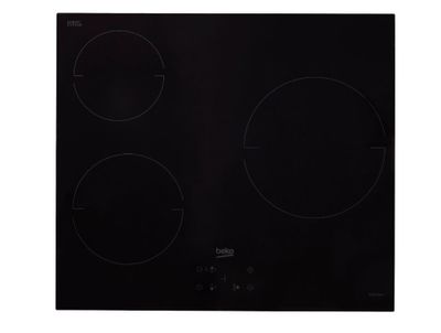 gros plan d'une cuisinière noire à trois brûleurs