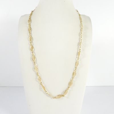 a close up of a necklace on a mannequin mannequin