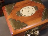 a small wooden box with a smiley face on it
