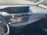 the dashboard of a car with a digital display in the center of it