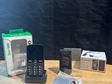 several cell phones are sitting on a table next to a box
