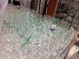 a lot of empty wine glasses on a table