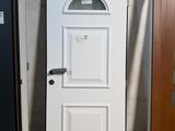 a white door and a brown door next to each other
