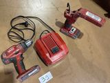 three tools are sitting on the floor in a room