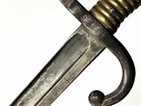 a close up of a sword on a white background