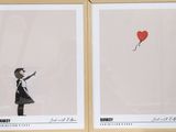 two framed pictures of a girl holding a red balloon and a red heart balloon
