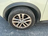 a close up of a car ' s tire on the road