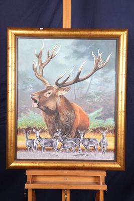 tableau représentant un cerf aux bois et un troupeau de cerfs, posé sur un chevalet