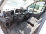 a white van with a steering wheel and a dashboard