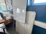 a white board on the wall in the room