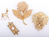 three gold brooches, a brooch, a brooch, a brooch, and a brooch