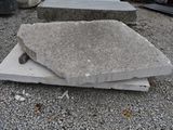 a pile of concrete blocks sitting on the ground