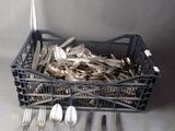 silverware in a basket with spoons, forks, and spoon spoons